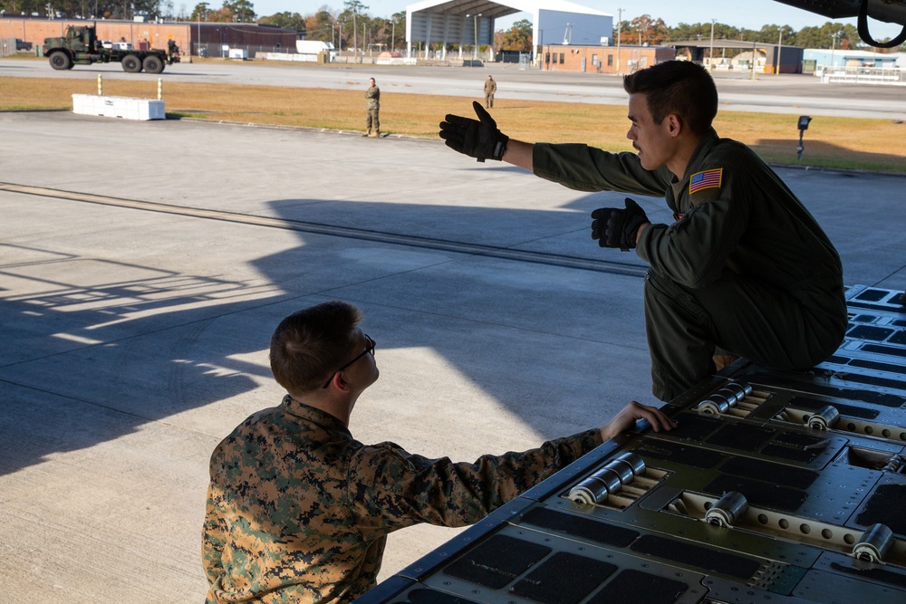 Marines and Airmen Load C-17