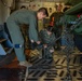 Marines and Airmen Load C-17