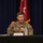 A U.S. Army Major General named Joseph Ryan is seated at a table speaking into a microphone during what appears to be a press conference or official briefing. He is identified by a nameplate as the 25th Infantry Division Commanding General and U.S. Army Hawaii Senior Commander. A red general officer flag with a star is visible in the background.