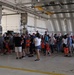 Volunteers pack donated goods into airdrop bundles during the 70th annual Operation Christmas Drop