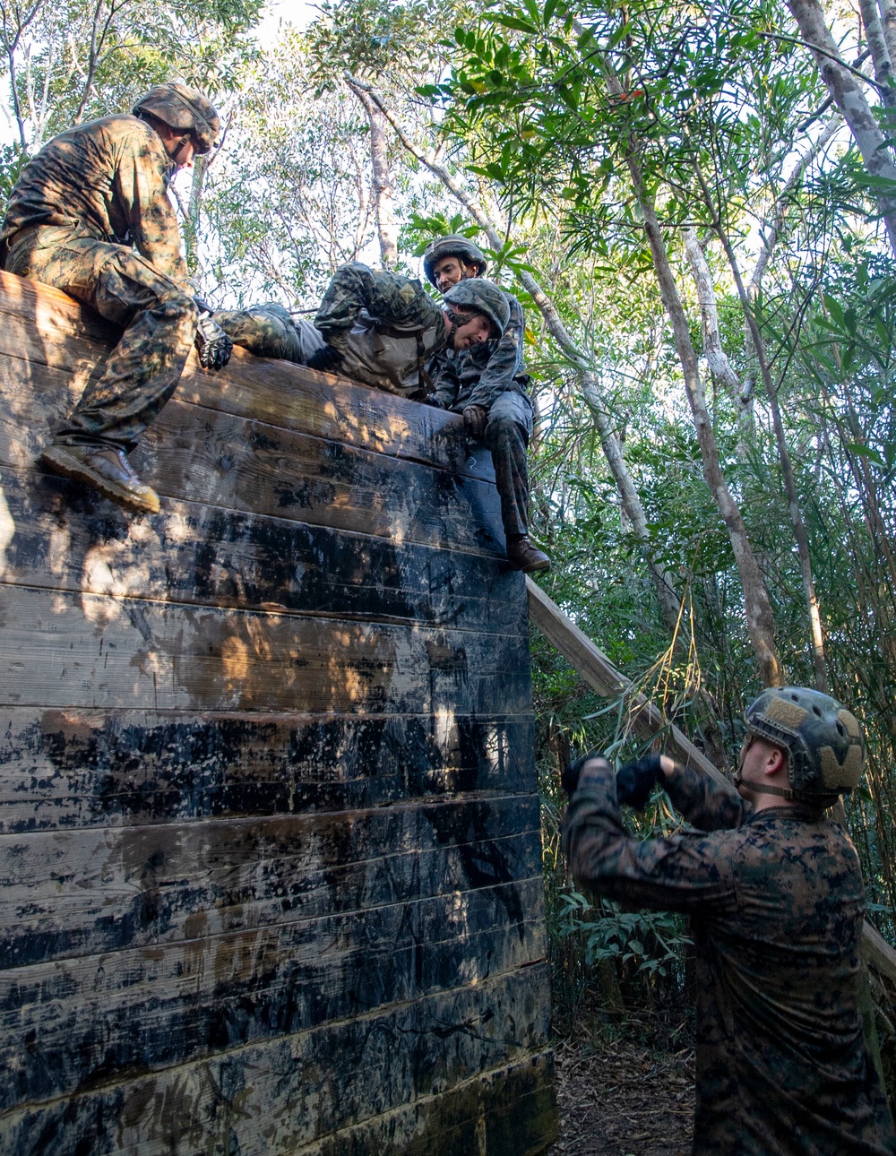 US Navy Seabees with NMCB-5 participate in joint training with Marines at the Basic Jungle Skills Course
