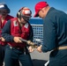 USS Sioux City Sailors Adjust Fire Hose Nozzle During Flight Deck Fire Drill