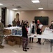 Andrews Spouses’ Club gives Airmen in dorms Mugs of Cheers
