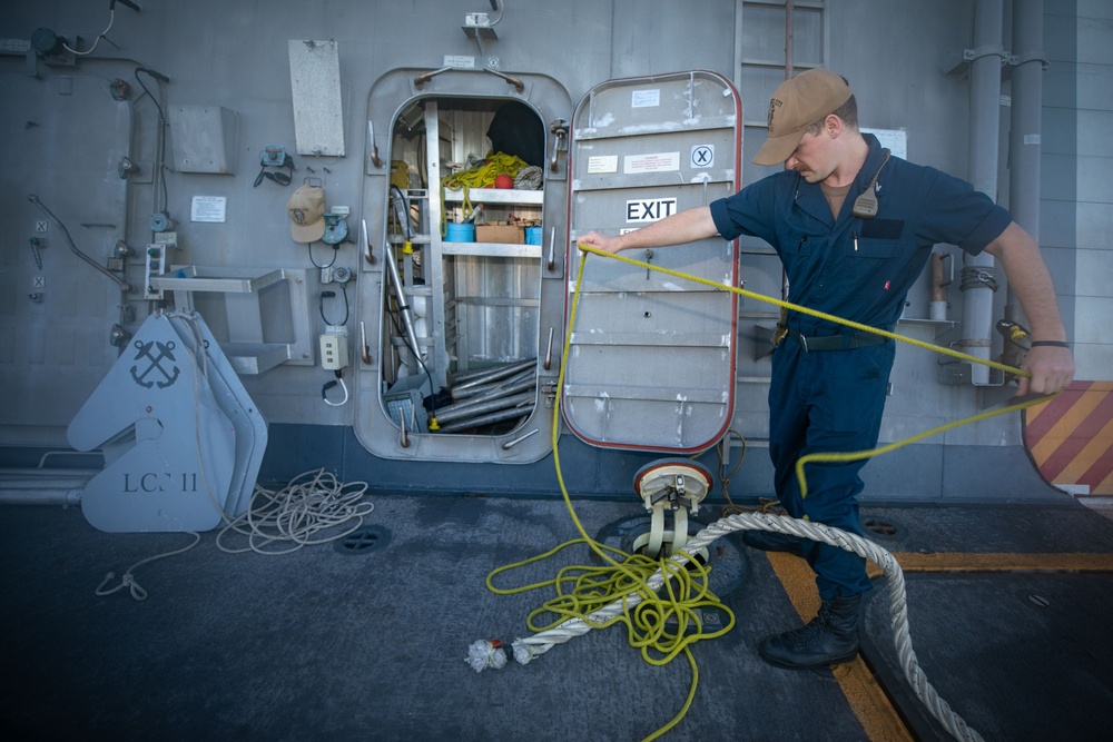 USS Sioux City Sailor Prepares a Heaving Line During Sea and Anchor Detail