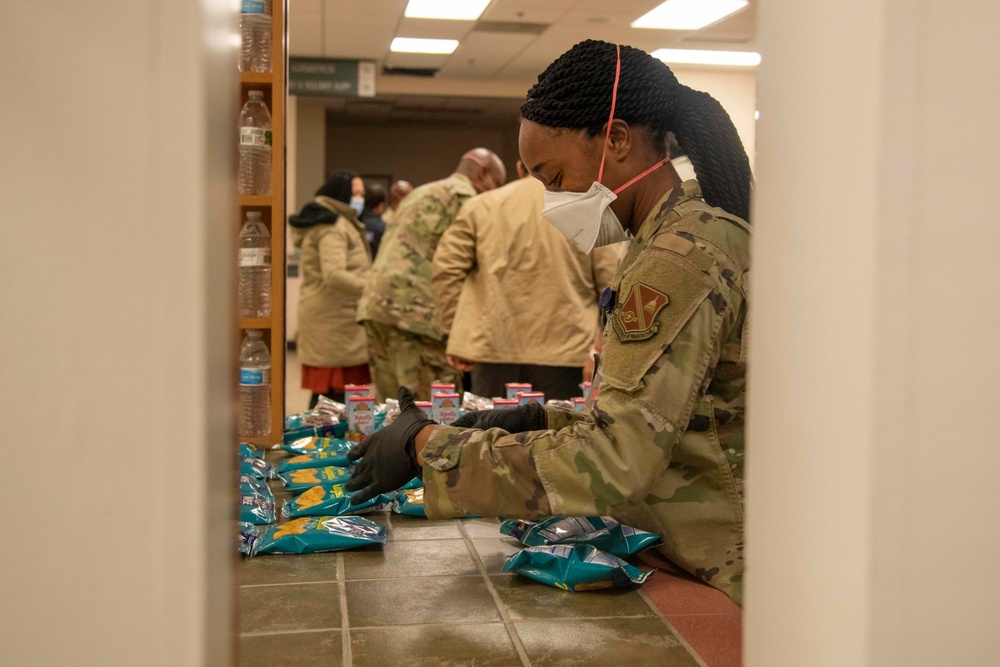 Afghan guests in-process through Task Force Liberty