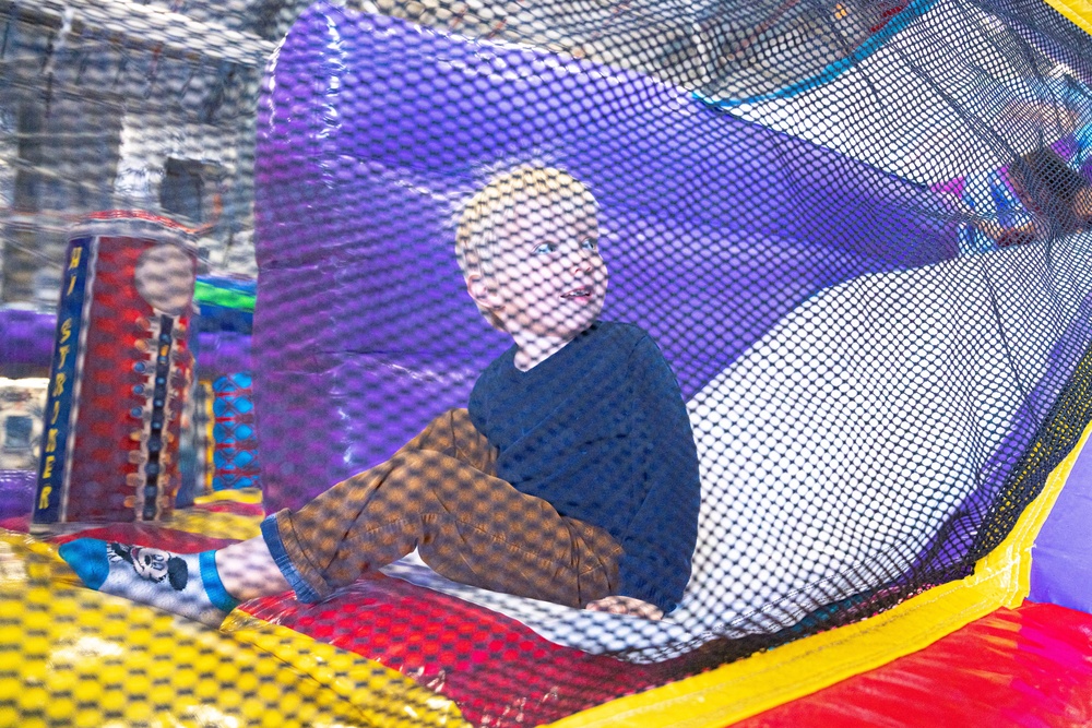 Airmen bring their families to work, to celebrate the holidays