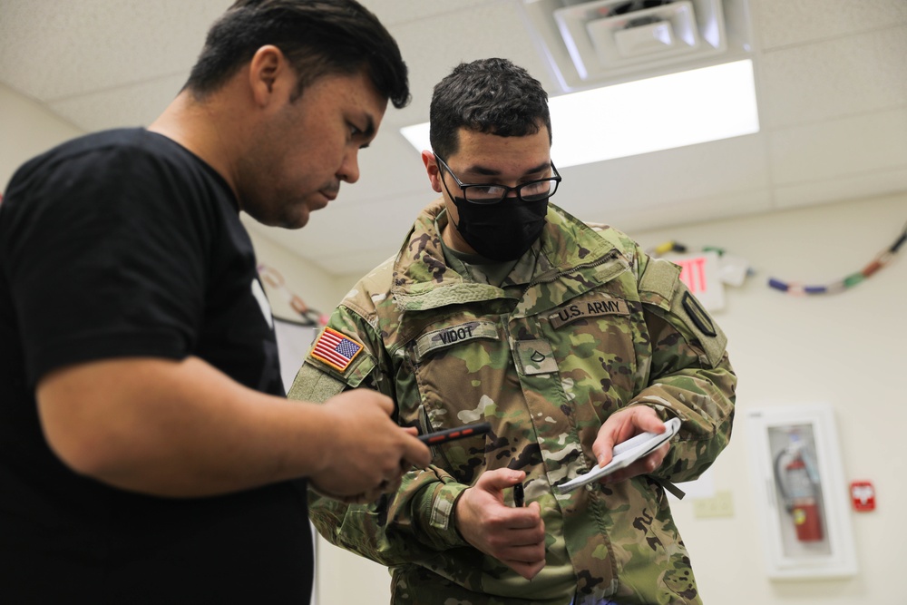 Task Force McCoy Soldiers Install Projectors in Afghan Evacuee Classrooms