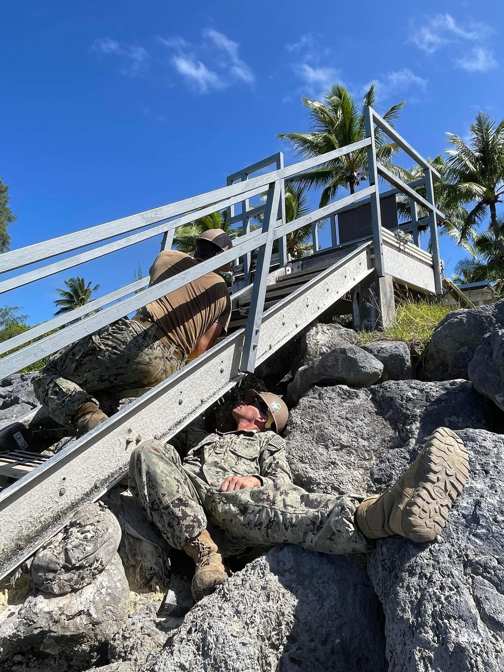 US Navy Seabees with NMCB- 5 repair a staircase for the locals in Marshall Islands