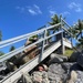 US Navy Seabees with NMCB- 5 repair a staircase for the locals in Marshall Islands