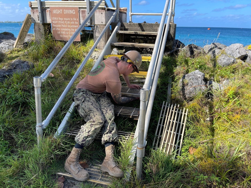 US Navy Seabees with NMCB- 5 repair a staircase for the locals in Marshall Islands