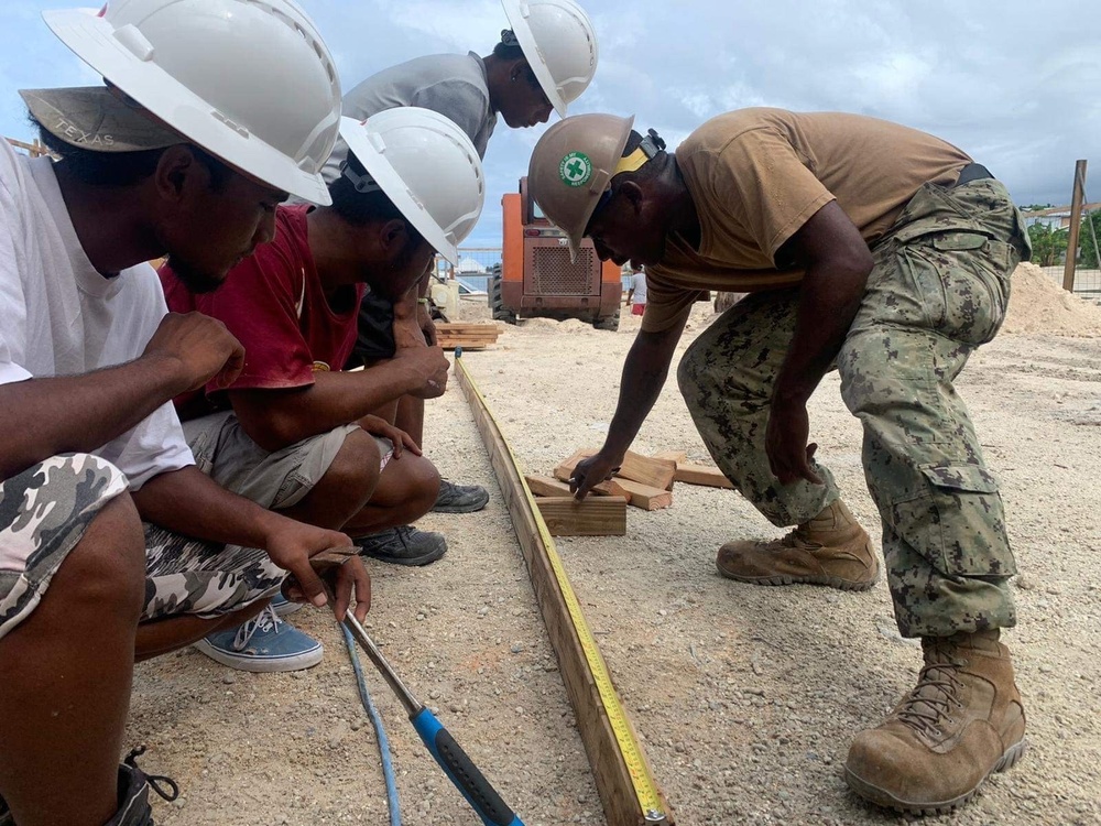 US Navy Seabees with NMCB- 5 instruct local Marshallese in Marshall Islands