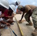 US Navy Seabees with NMCB- 5 instruct local Marshallese in Marshall Islands