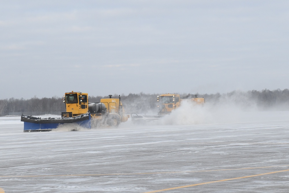 Air National Guard Heavy Equipment Operators remove snow