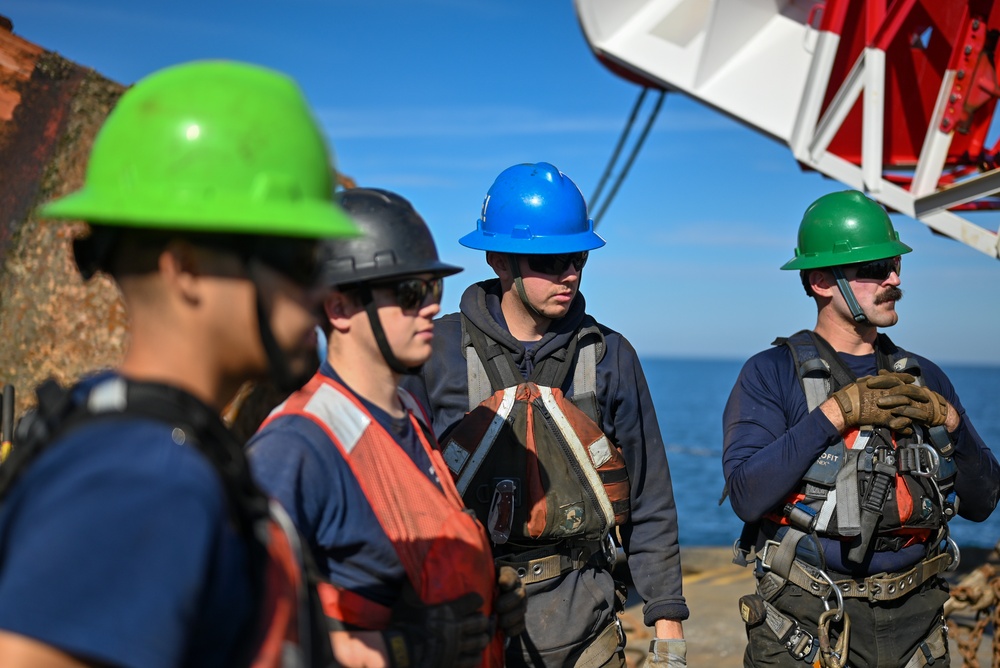 Crew members aboard USCGC Sycamore gather for buoy evolution