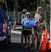 Military volunteers distribute water