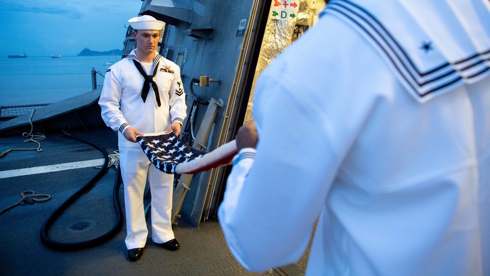 USS Charleston Sailor Participates in Evening Colors