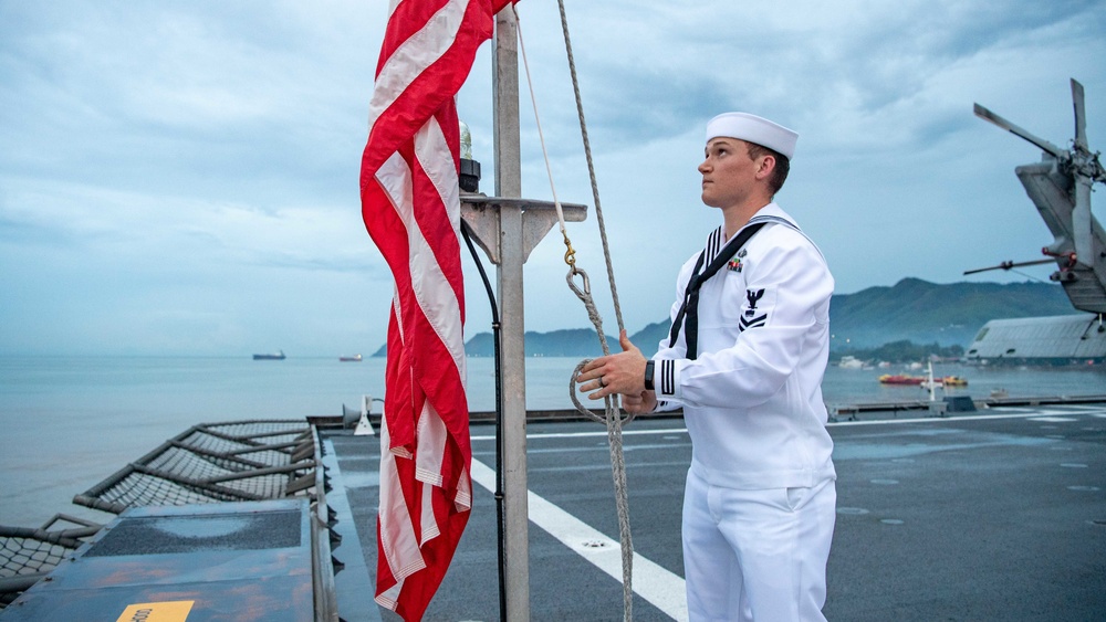 USS Charleston Sailor Participates in Evening Colors