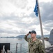 USS Charleston Sailor Observes Morning Colors