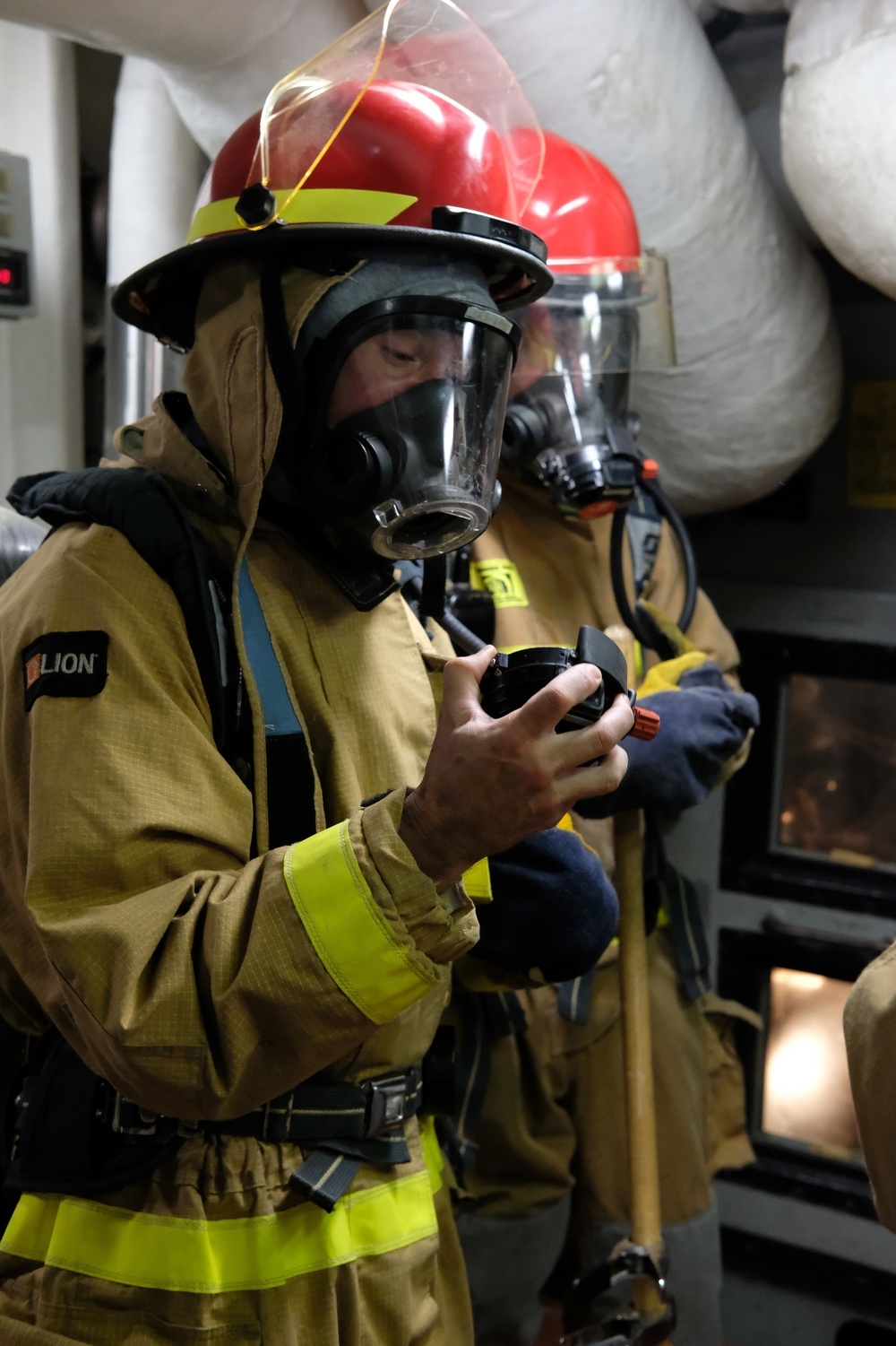 Sailors aboard USS Lake Champlain conduct firefighting drills while in Guam