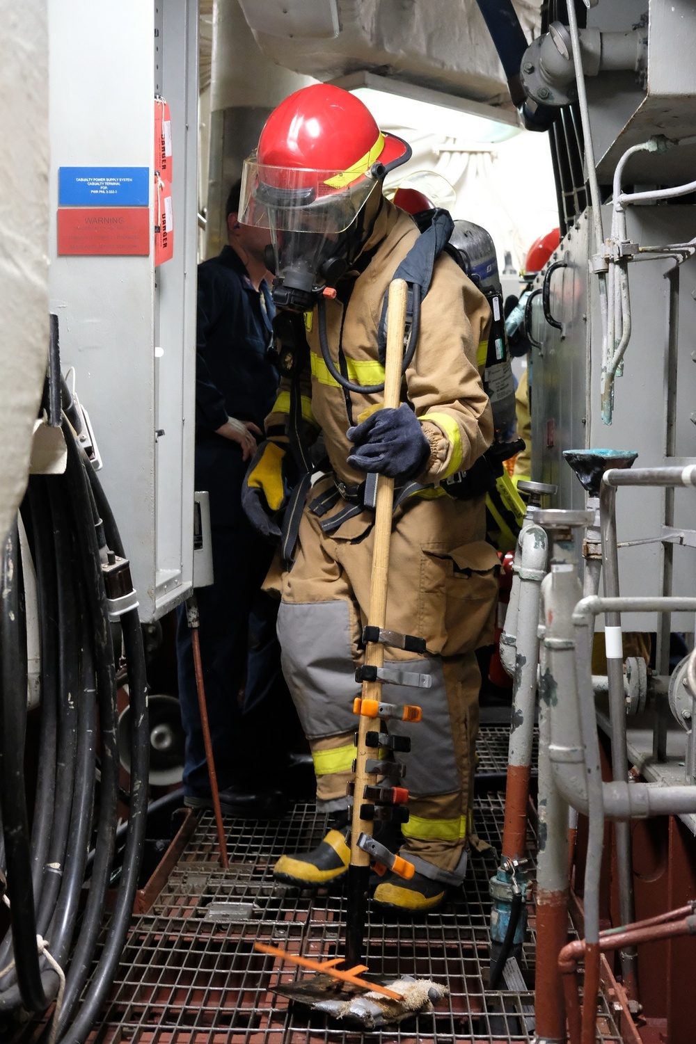 Sailors aboard USS Lake Champlain conduct firefighting drills while in Guam