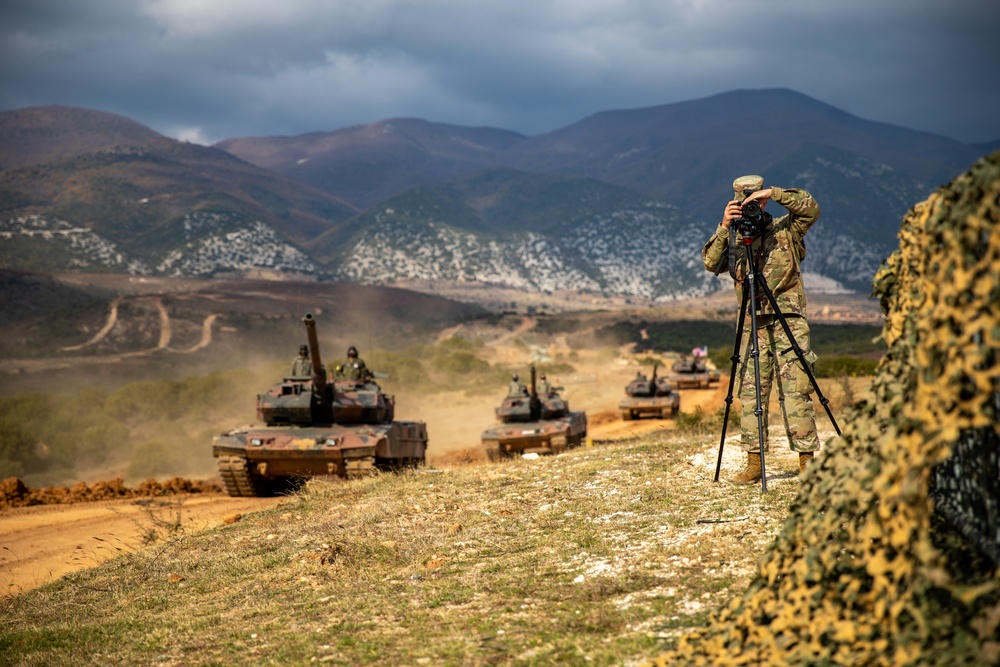 Army National Guard Public Affairs Soldier takes aim during joint exercise in Greece