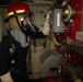 USS Sioux City Sailor Safety Checks Equipment During Mass Conflagration Drill