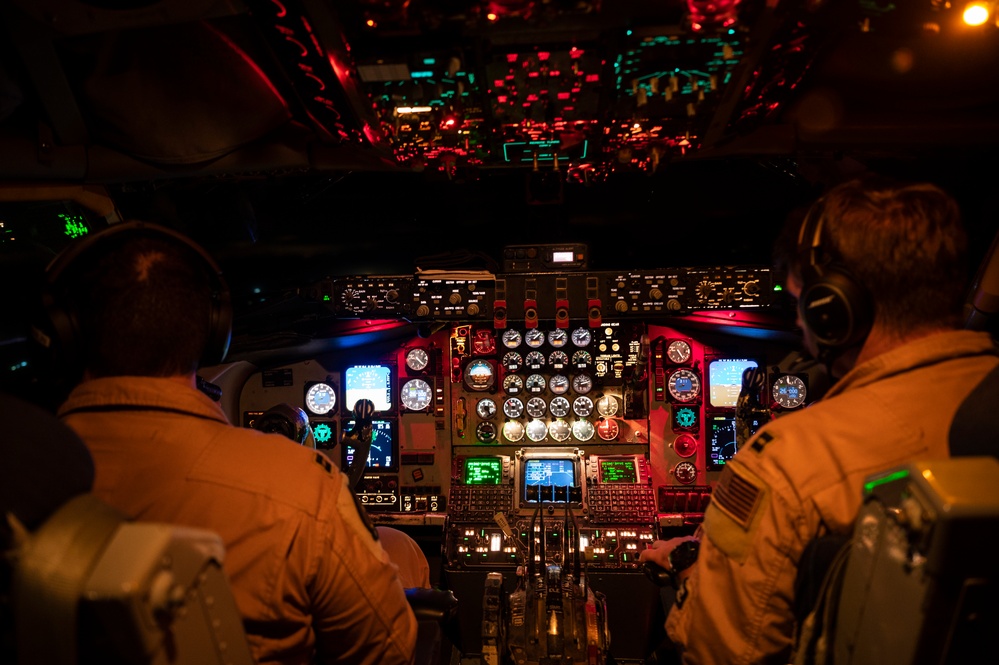 KC-135 refuels Fighting Falcons under darkness