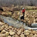 Natural-resources personnel conduct water testing at Fort McCoy