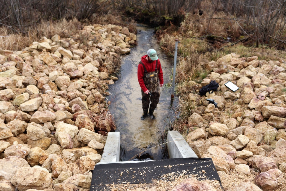 Natural-resources personnel conduct water testing at Fort McCoy