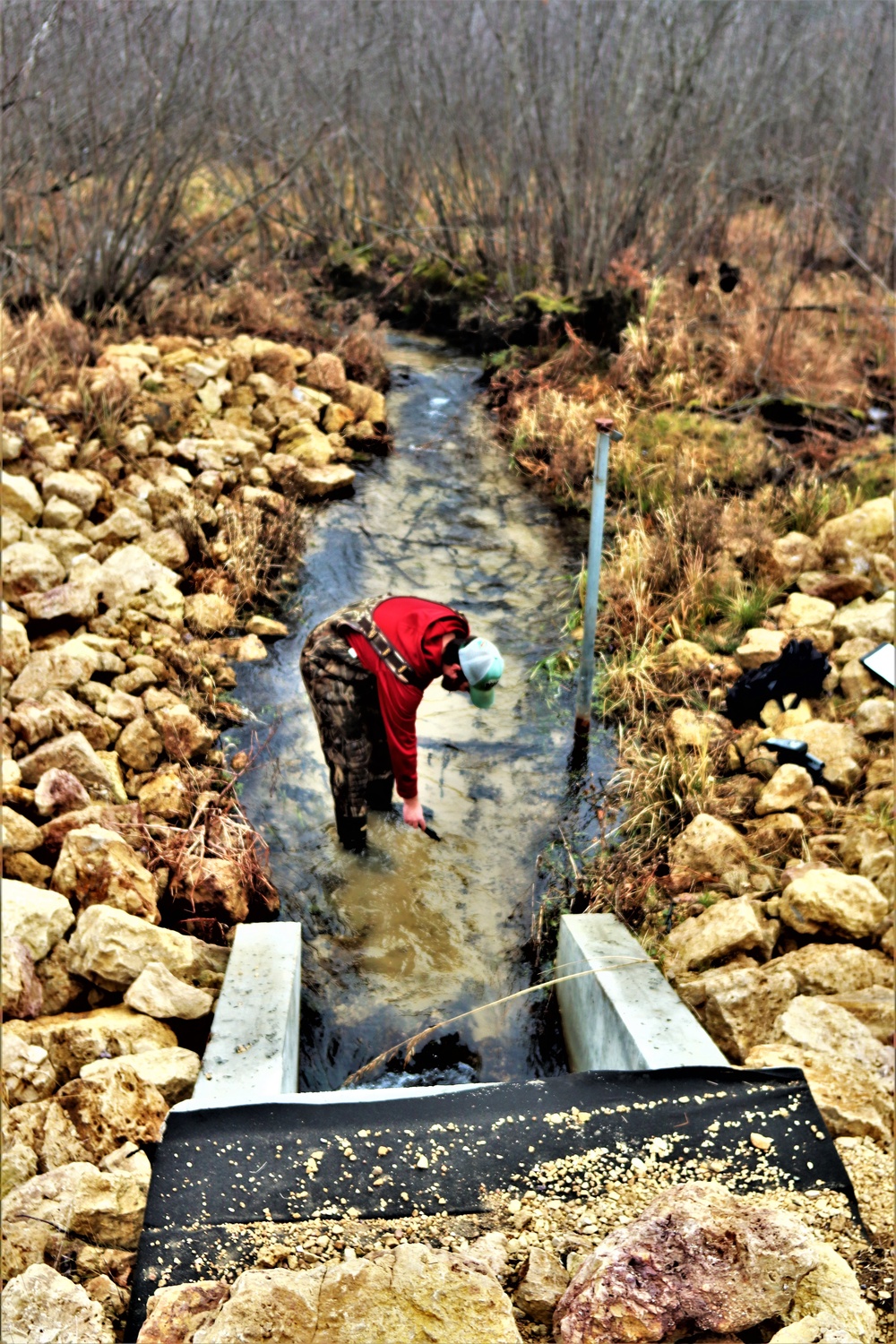 Natural-resources personnel conduct water testing at Fort McCoy