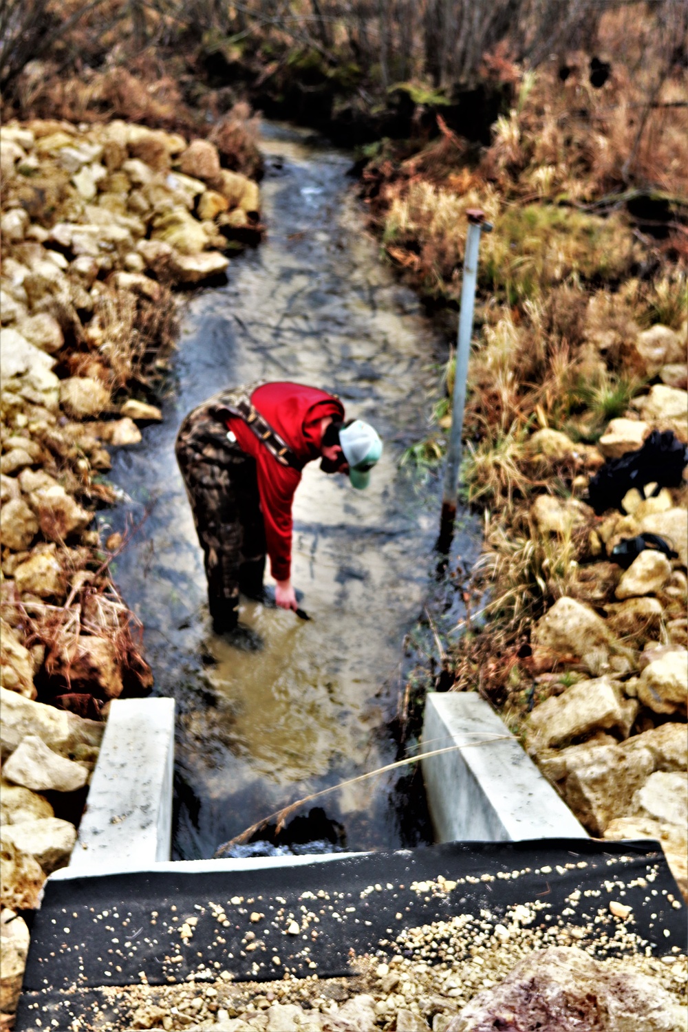 Natural-resources personnel conduct water testing at Fort McCoy