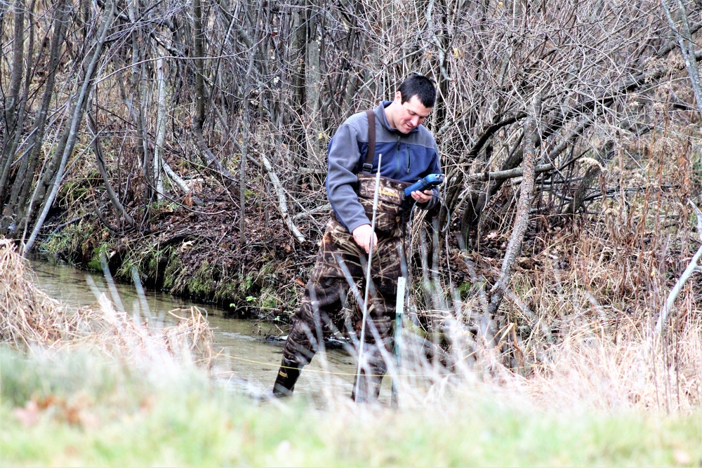 Natural-resources personnel conduct water testing at Fort McCoy