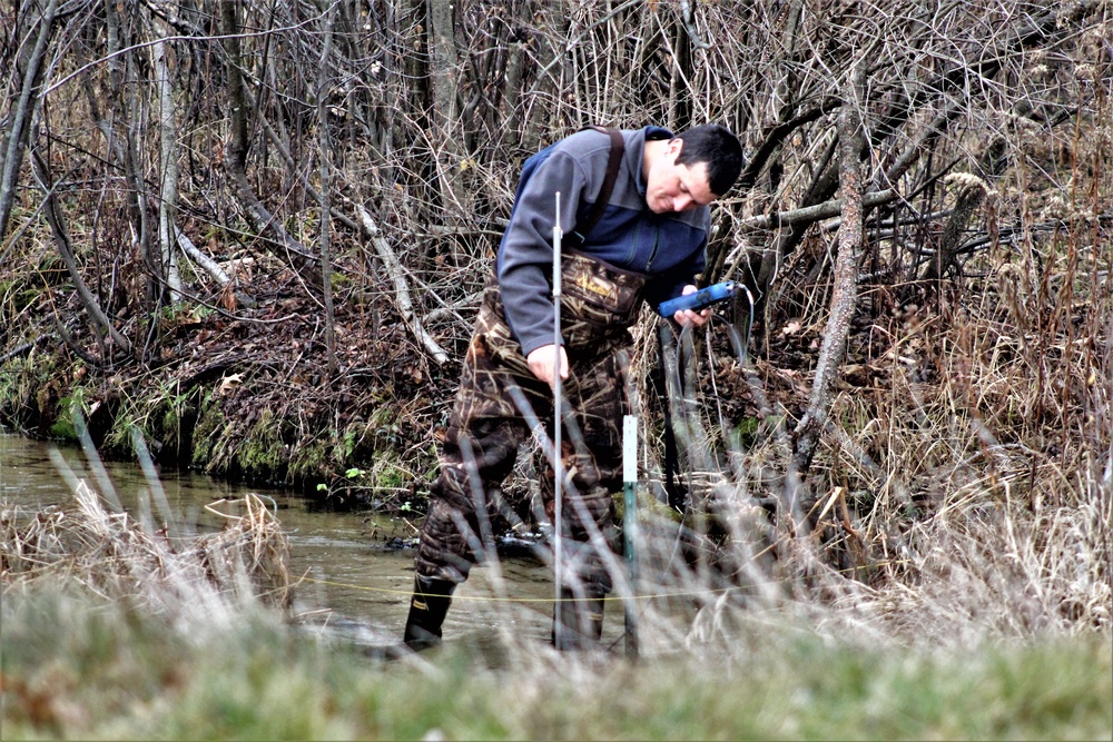 Natural-resources personnel conduct water testing at Fort McCoy