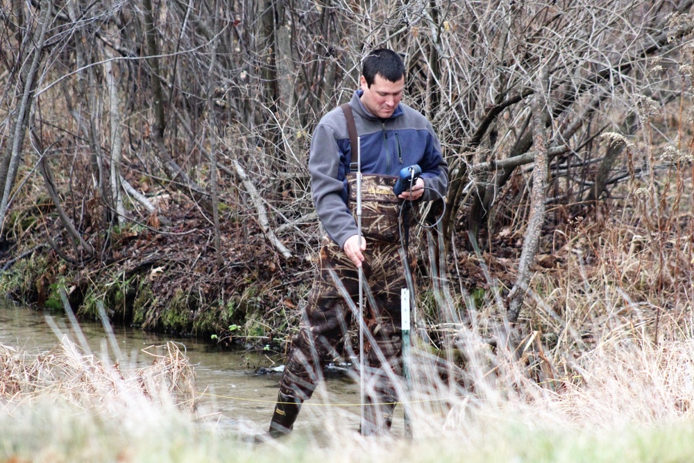 Natural-resources personnel conduct water testing at Fort McCoy