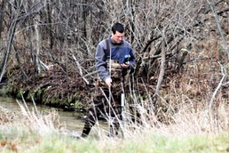Natural-resources personnel conduct water testing at Fort McCoy