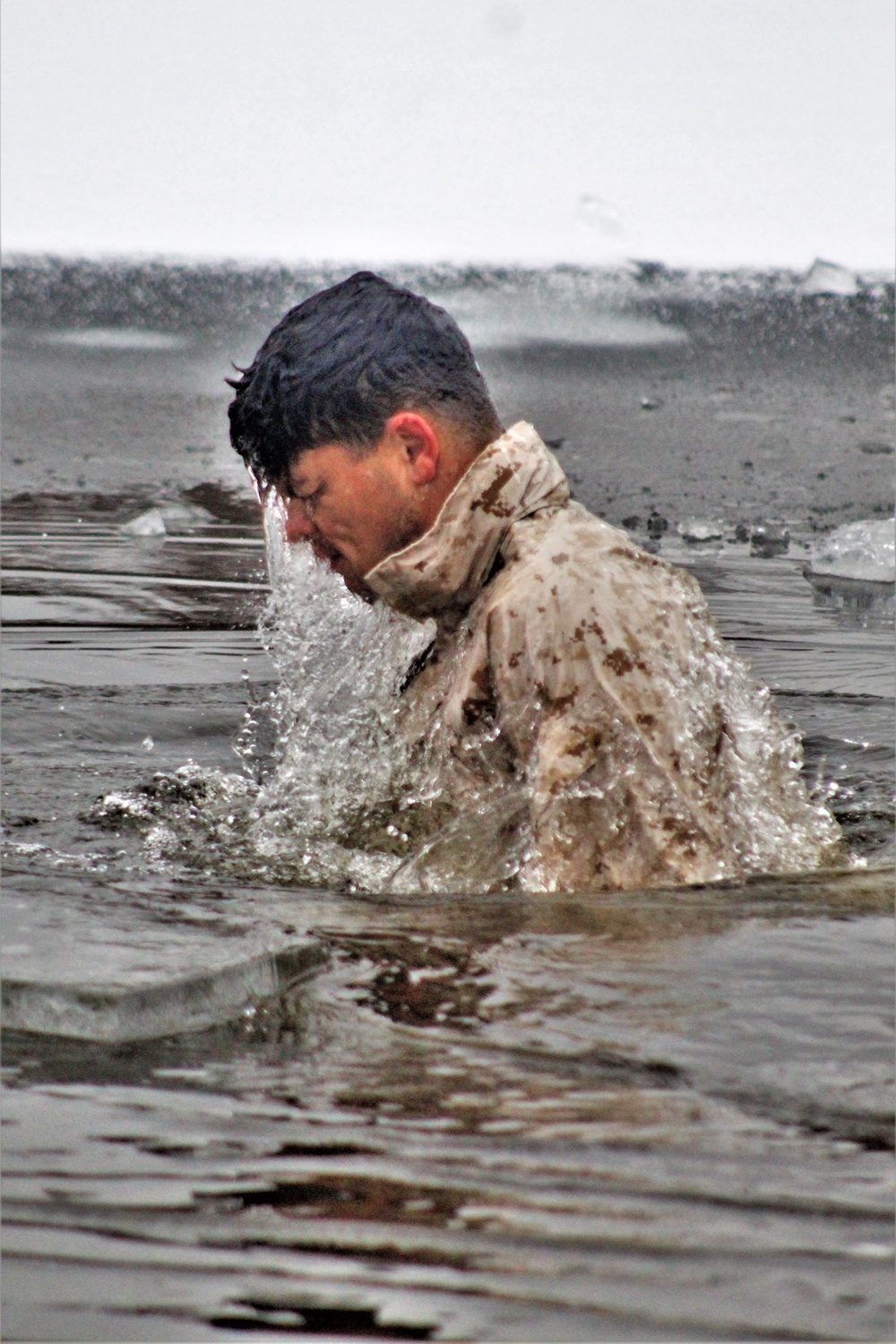 6th Marine Regiment troops jump in for cold-water immersion training at Fort McCoy