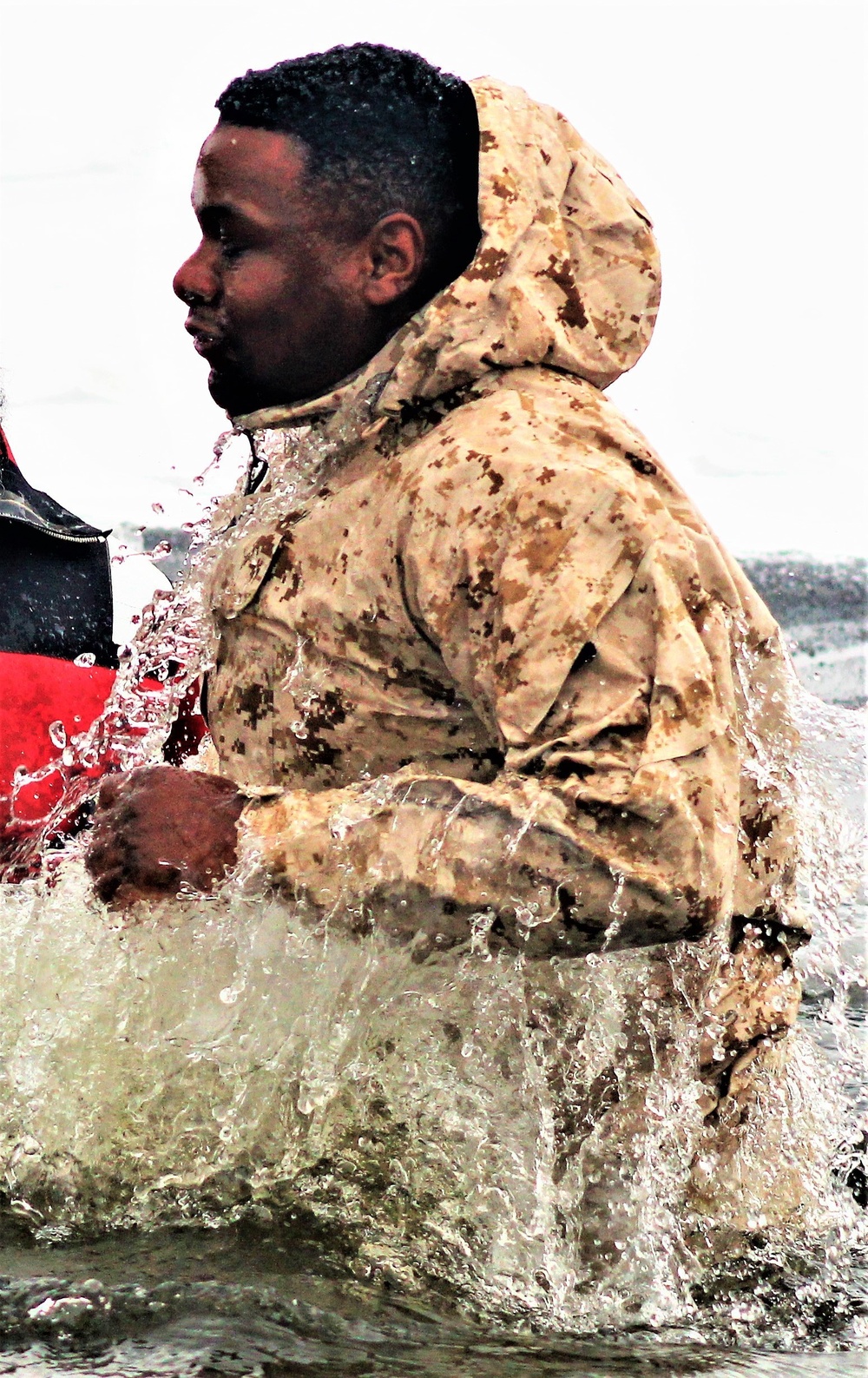 6th Marine Regiment troops jump in for cold-water immersion training at Fort McCoy