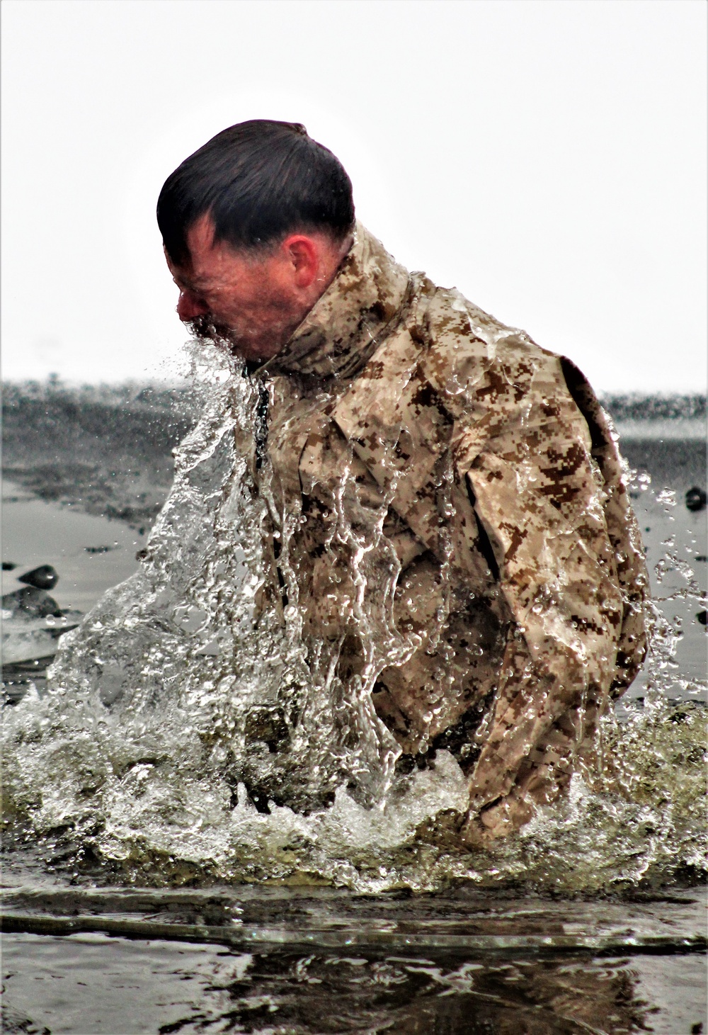 6th Marine Regiment troops jump in for cold-water immersion training at Fort McCoy