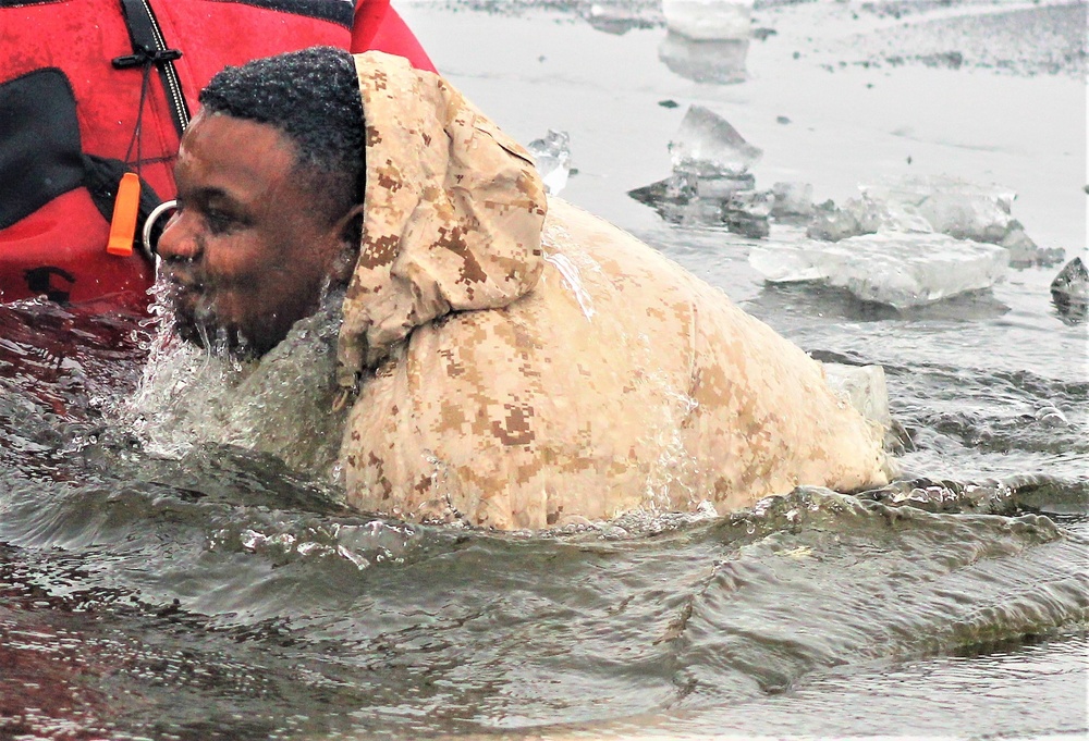 6th Marine Regiment troops jump in for cold-water immersion training at Fort McCoy