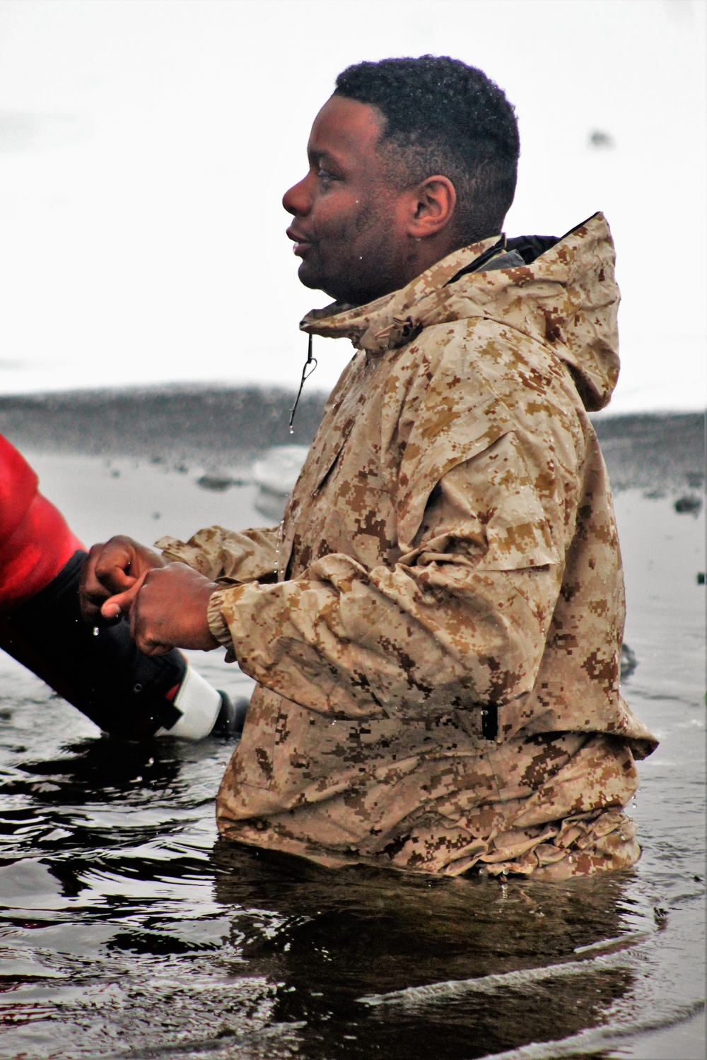 6th Marine Regiment troops jump in for cold-water immersion training at Fort McCoy