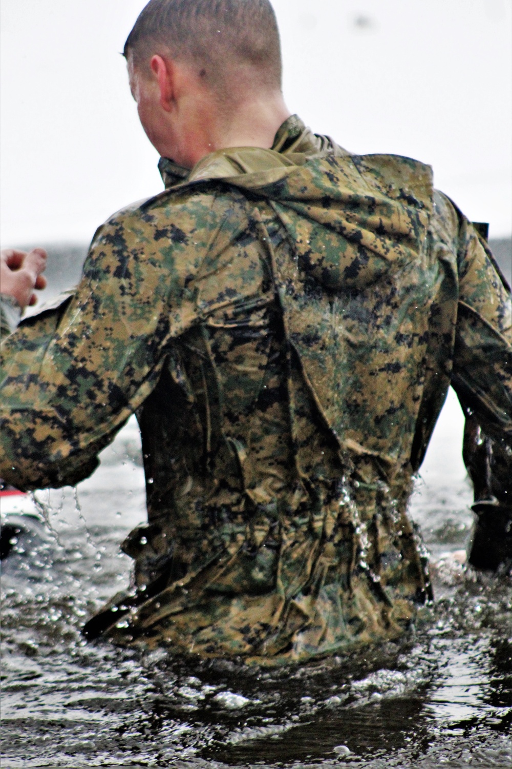 6th Marine Regiment troops jump in for cold-water immersion training at Fort McCoy