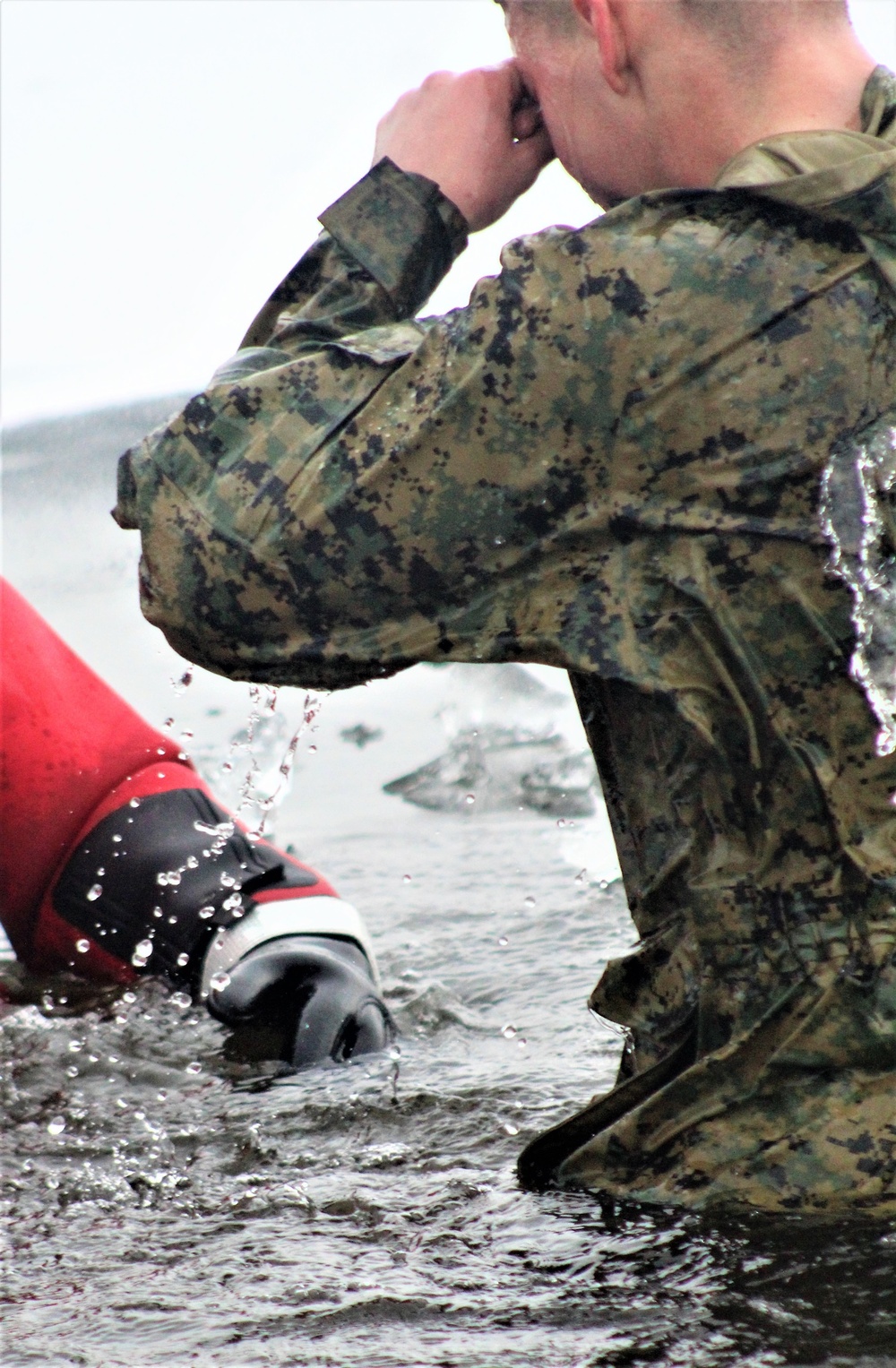 6th Marine Regiment troops jump in for cold-water immersion training at Fort McCoy