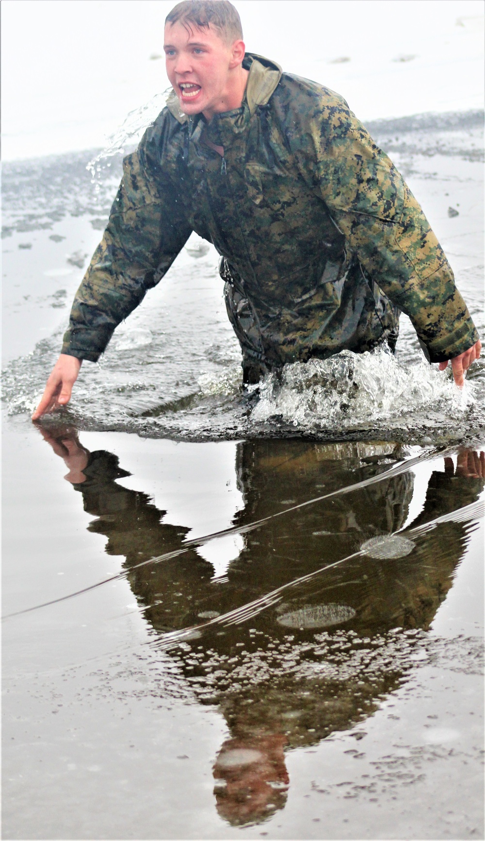 6th Marine Regiment troops jump in for cold-water immersion training at Fort McCoy