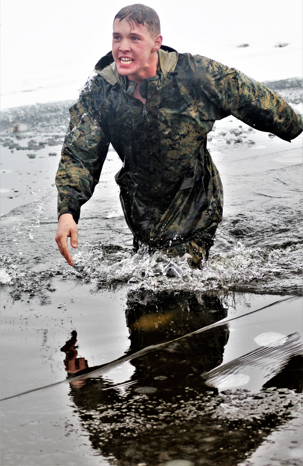 6th Marine Regiment troops jump in for cold-water immersion training at Fort McCoy