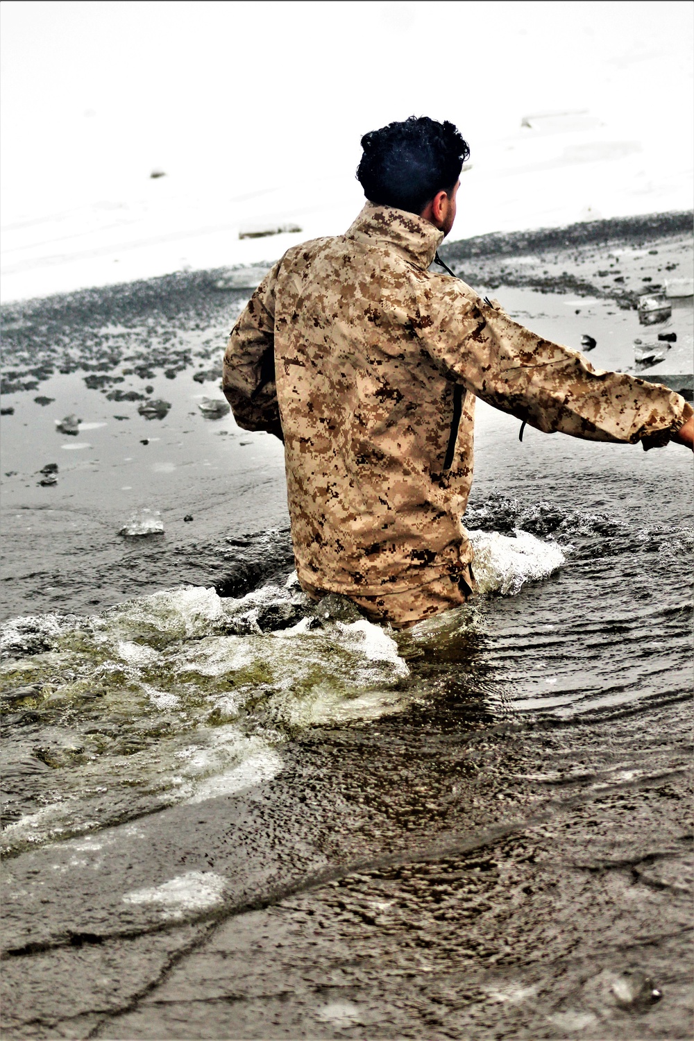 6th Marine Regiment troops jump in for cold-water immersion training at Fort McCoy