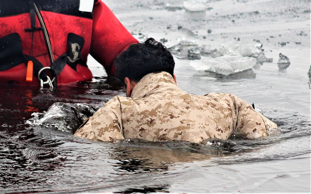 6th Marine Regiment troops jump in for cold-water immersion training at Fort McCoy