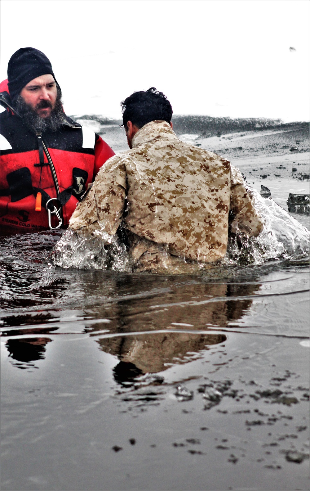 6th Marine Regiment troops jump in for cold-water immersion training at Fort McCoy