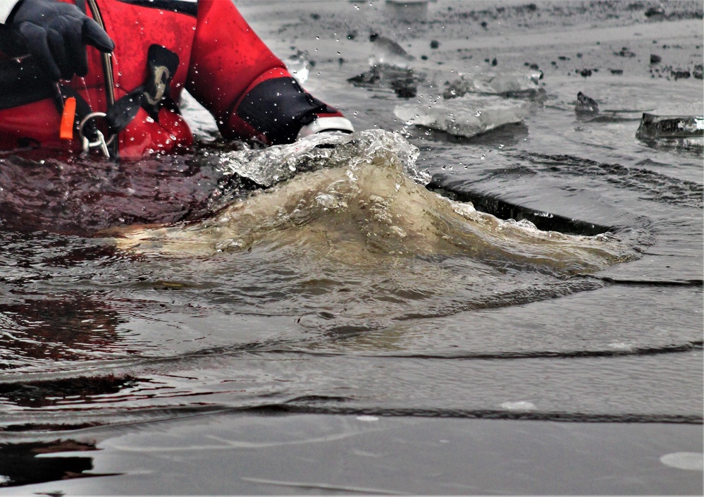 6th Marine Regiment troops jump in for cold-water immersion training at Fort McCoy