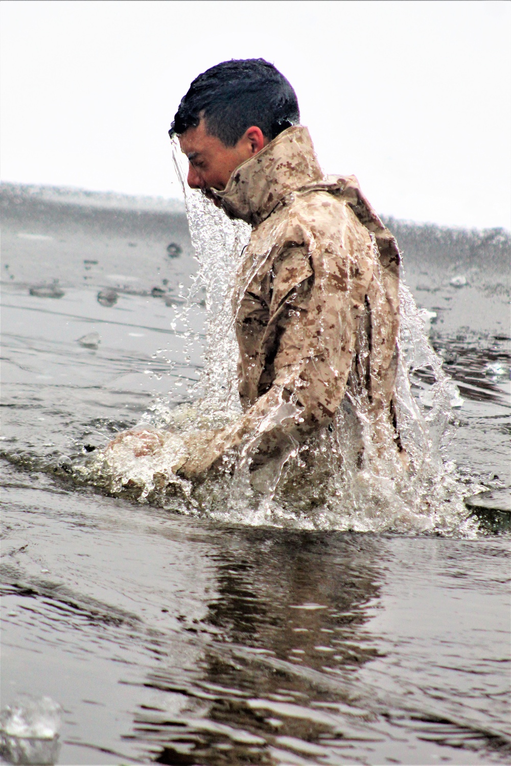 6th Marine Regiment troops jump in for cold-water immersion training at Fort McCoy