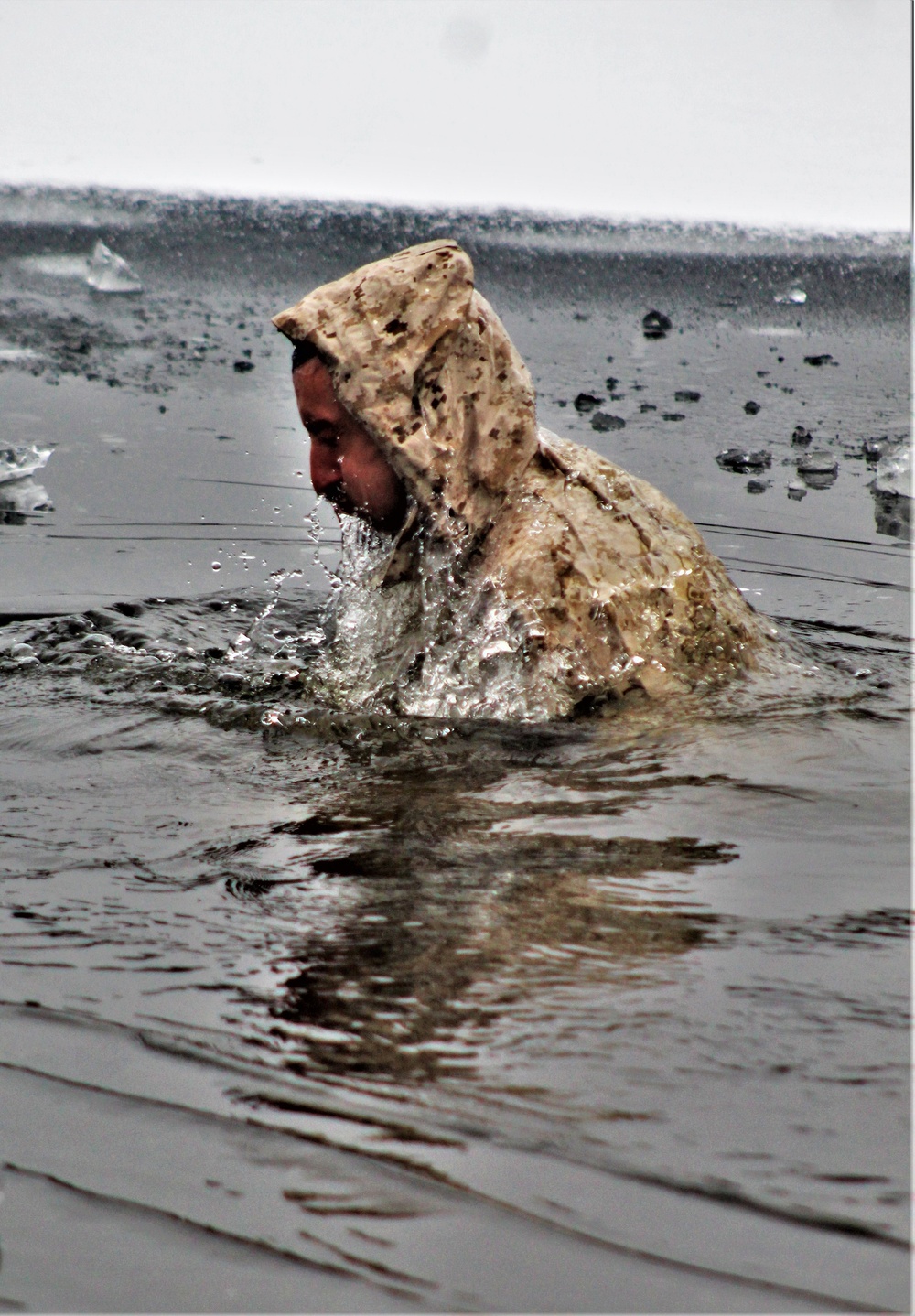 6th Marine Regiment troops jump in for cold-water immersion training at Fort McCoy